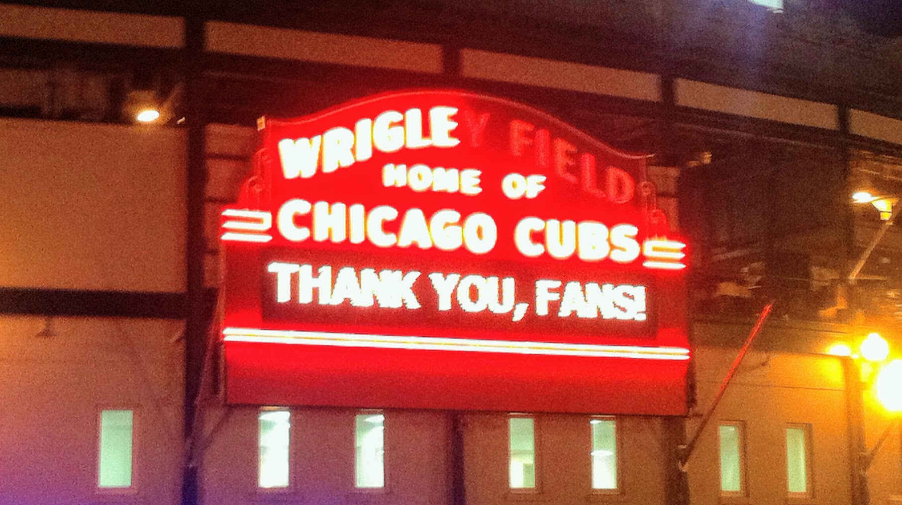 wrigley field's marquee, half burned-out. How metta for the time